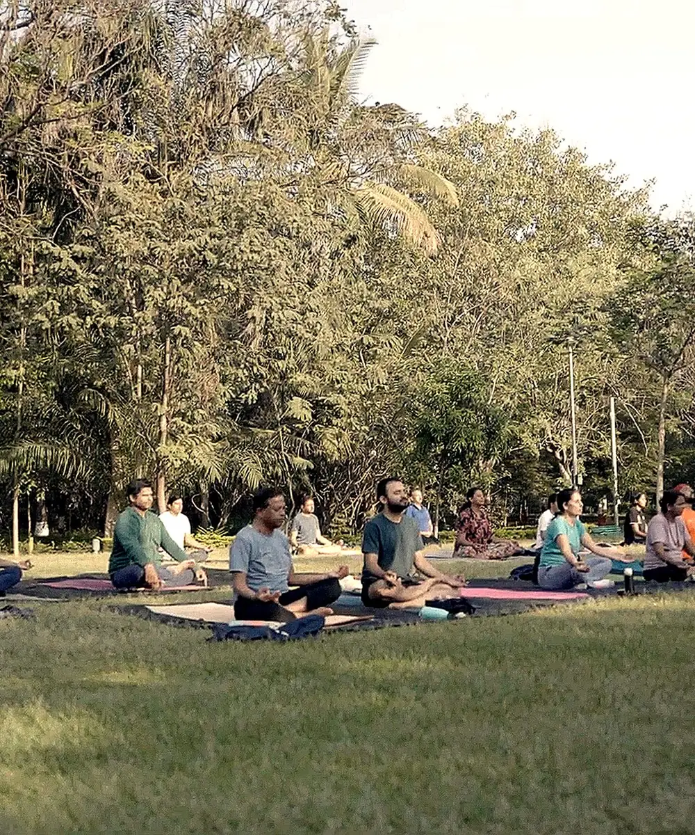 Group yoga and meditation session outdoors at Vrnda